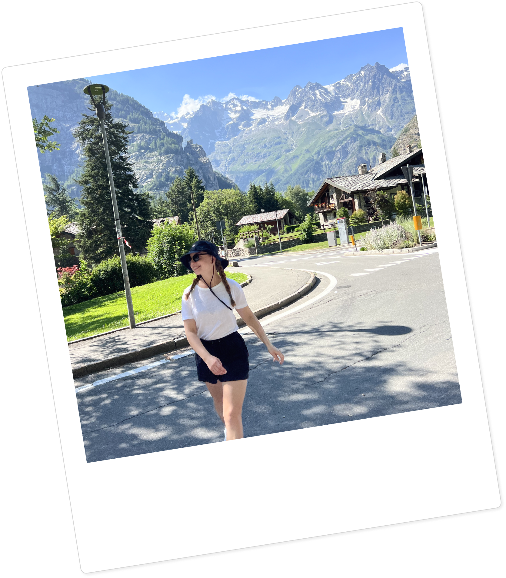 Paulina standing in front of a mountain landscape.